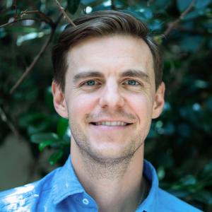 Headshot of Adam Harrison.